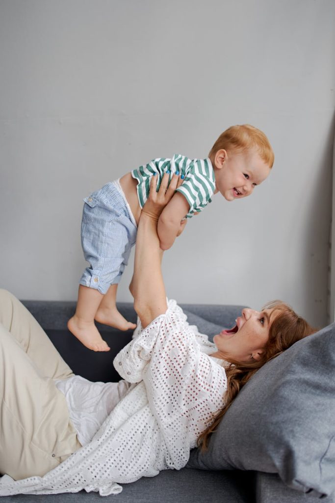 mother and baby having fun playing in the living room