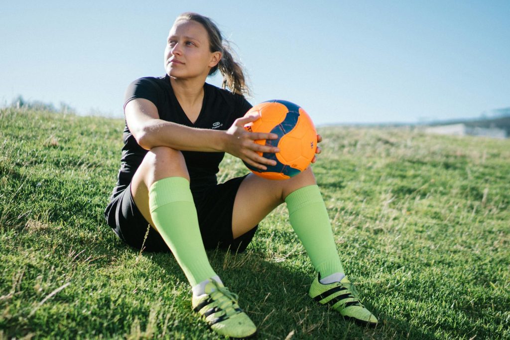 photo of woman holding ball